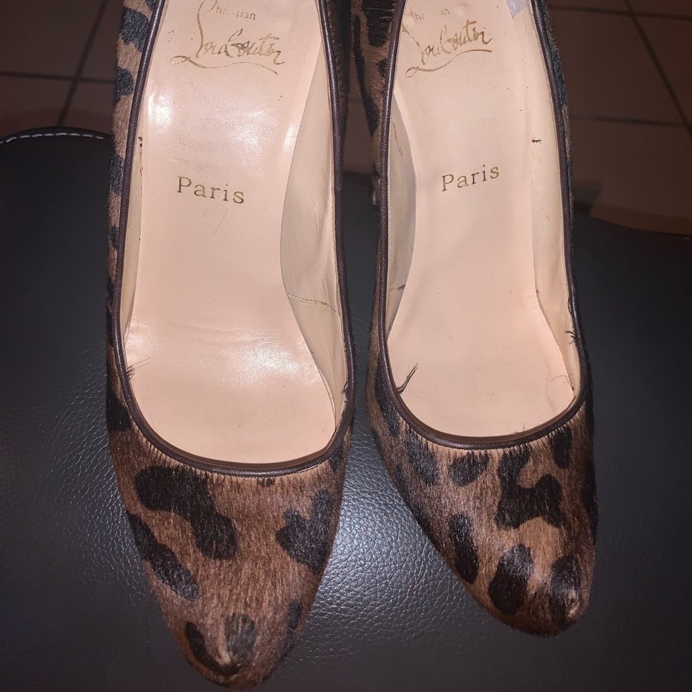 Christian Louboutins Leopard print red bottoms